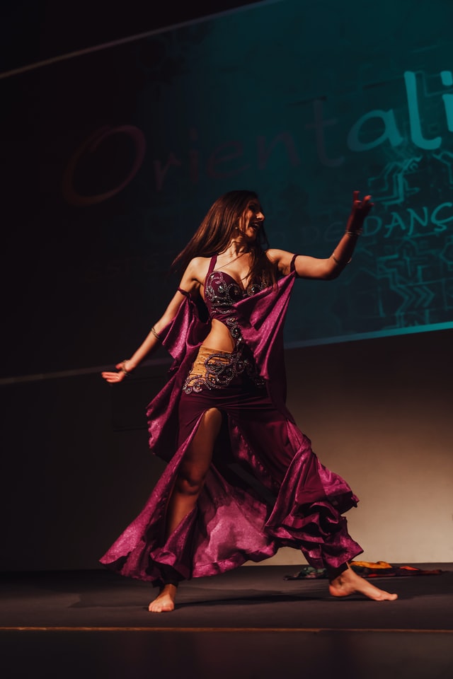 Professional bollywood dance class in Manchester city centre studio with students practicing vibrant Indian dance moves and expressive hand gestures