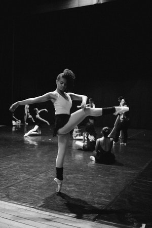 Professional stretching class in Manchester city centre studio with instructor demonstrating flexibility exercises and mobility training in peaceful environment