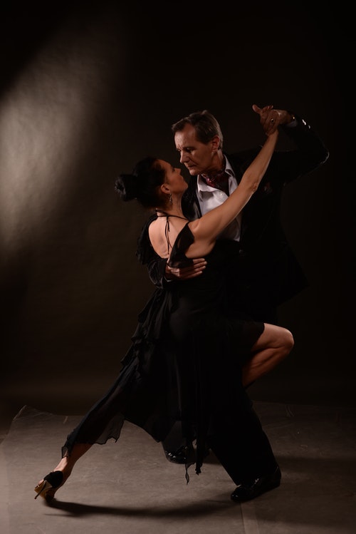 Professional tango dance class in Manchester city centre studio with couples practicing Argentine tango embrace and passionate partner connection on sprung floors